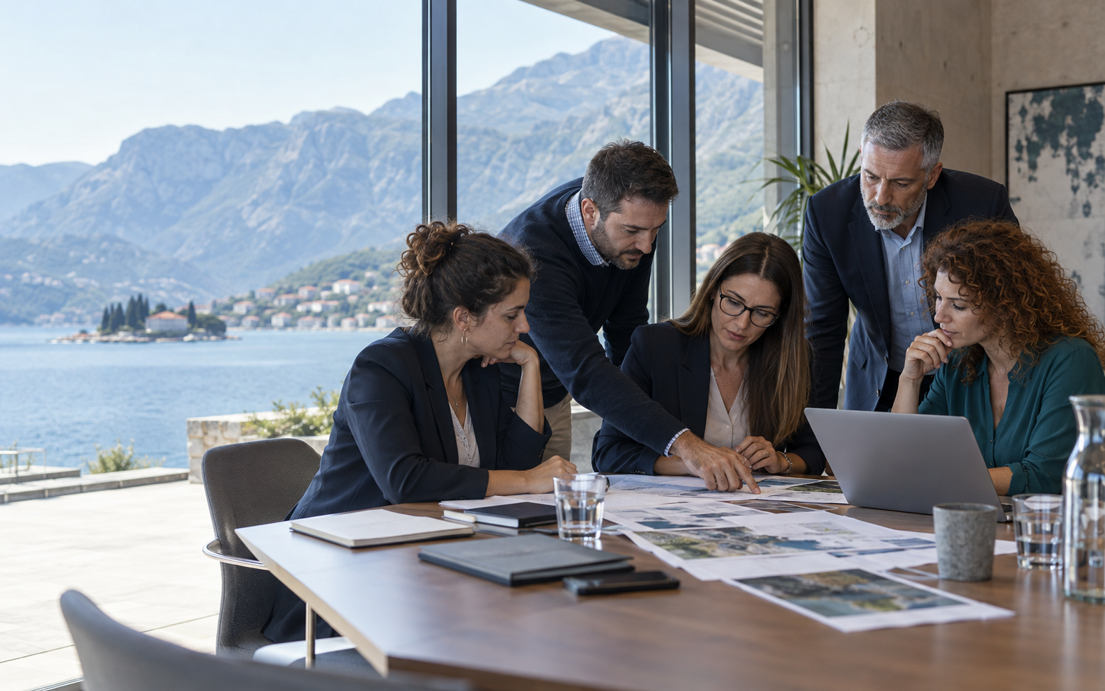 International project coordinators reviewing plans during a workshop in Montenegro